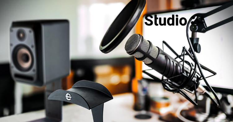 Podcast production Dhaka desk with mixer, laptop, headphones, and recording microphones