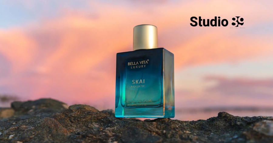 Product photography Dhaka featuring perfume bottle on rocks with sunset background
