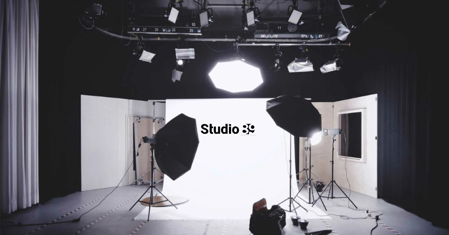 Professional podcast and video production studio Dhaka with high-end cameras, lighting, and desk setup.