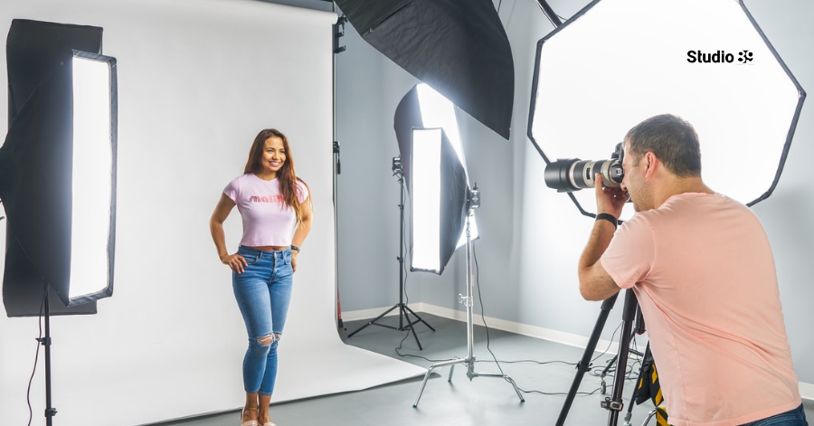 Photographer shooting a model with professional softbox lighting at the Best Best Studio Rental in Dhaka.