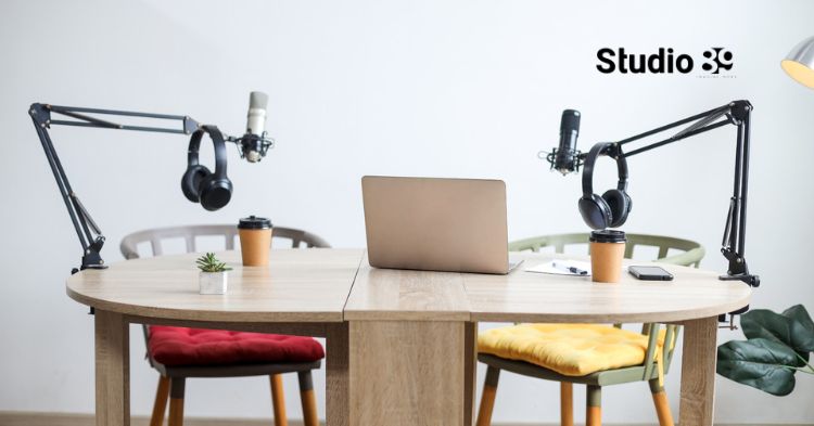 Podcast studio vs home setup in Dhaka showing a simple table podcast recording setup with two microphones, laptop, chairs, and Studio89 branding for creators